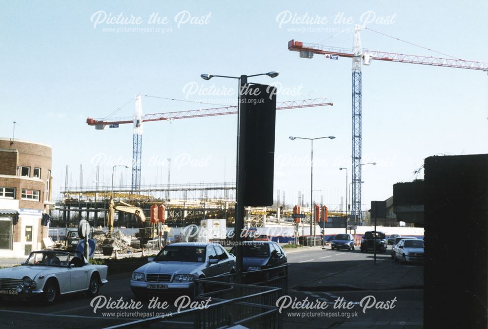 2 photographs showing the development of the Cock Pit Car Park and the Bus Station,Cock Pit Island