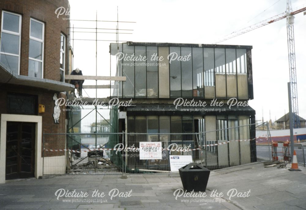 2 photographs showing the demolition of the pedestrian access between the Bus Station and The Eagle 