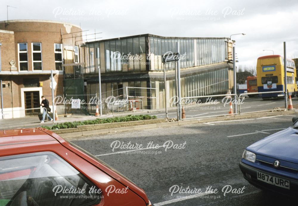 2 photographs showing the demolition of the pedestrian access between the Bus Station and The Eagle 