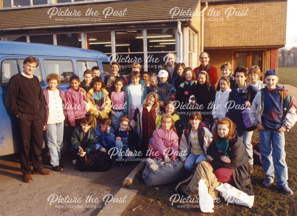 Merrill School,class grouped by a minibus ready for a school trip