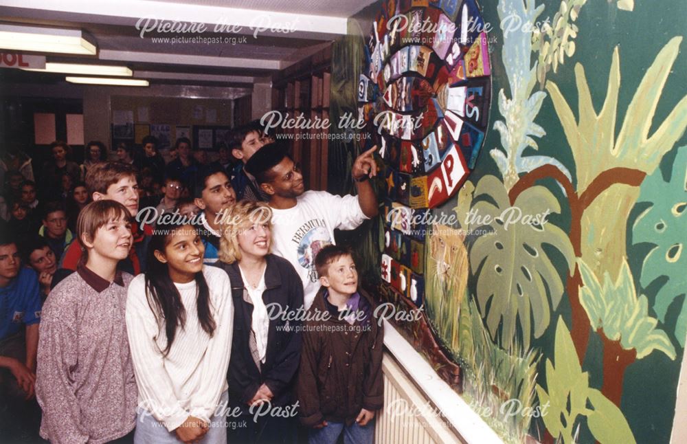 Children looking at a mural at Noel Baker School
