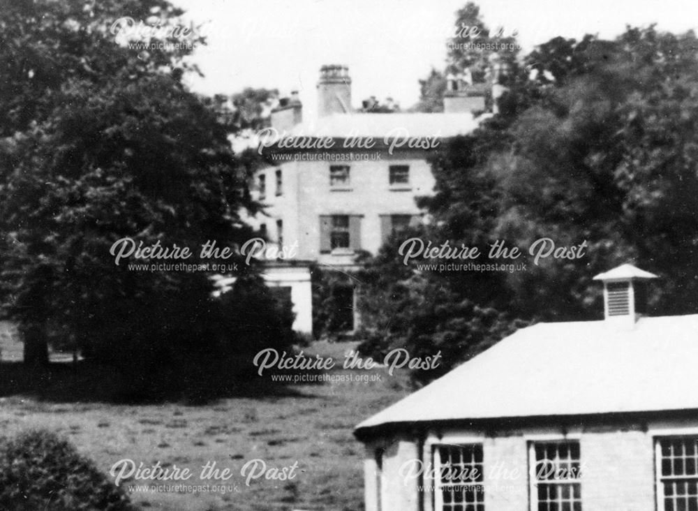 View of house, between trees in Darley Park