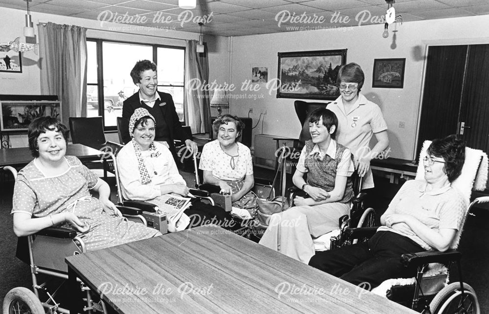 Patients and staff in a communal lounge in King's Lodge , the City Hospital