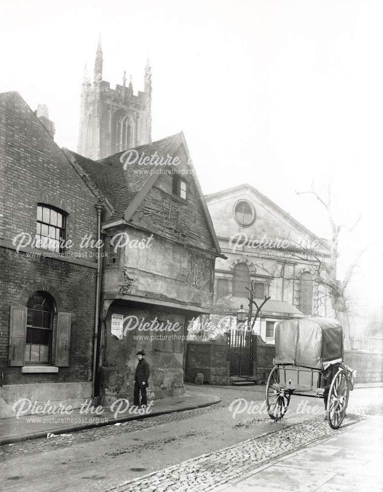 View showing an old house at the corner of Full Street and the rear of the Cathedral