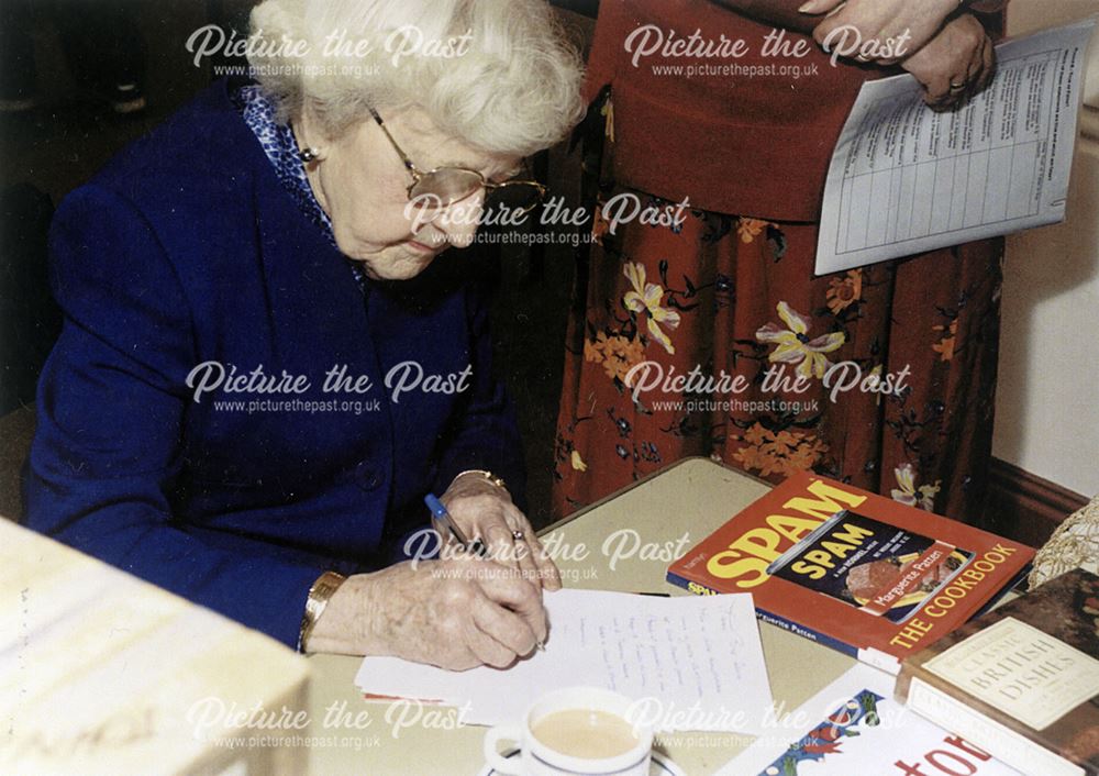 Margueritte Patton writing at Derby Central Library