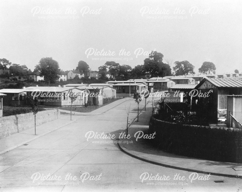 Street of pre-fabricated houses and concrete road