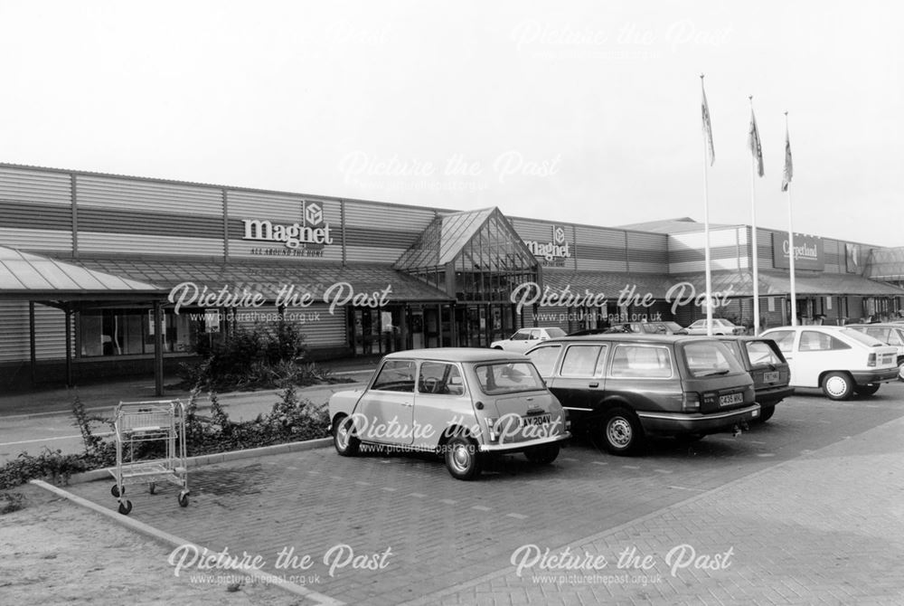 Shop frontages and car park,Meteor Centre