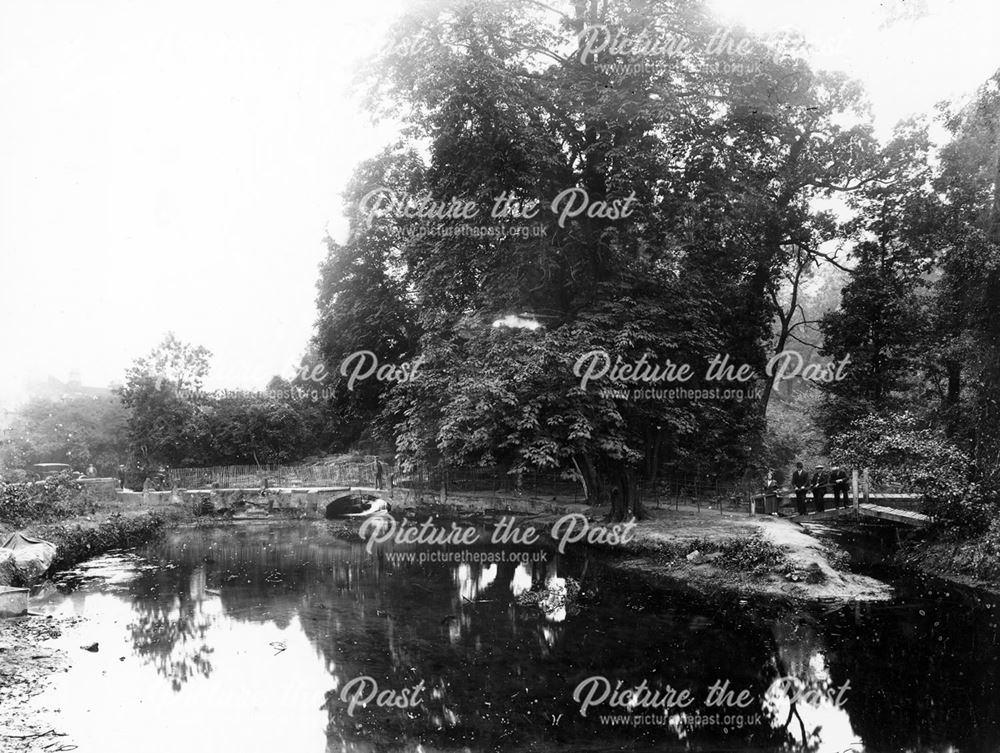 Lake, wooden bridge and stone bridge under construction