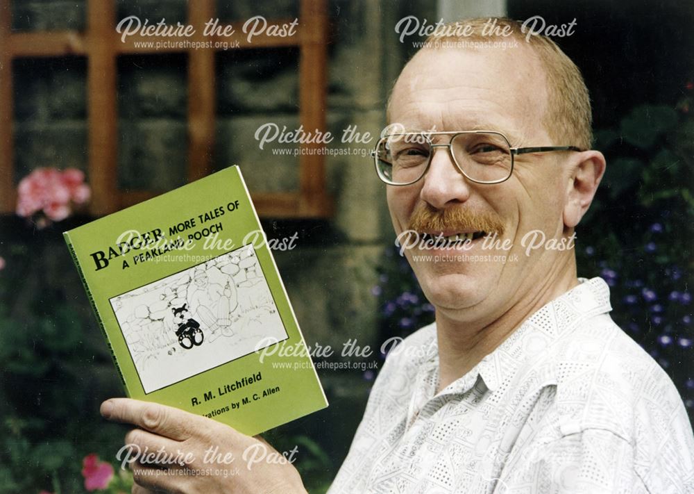 Photgraph of local author R.M.Litchfield with his book, 'Badger,More Tales of A Peakland Pooch'