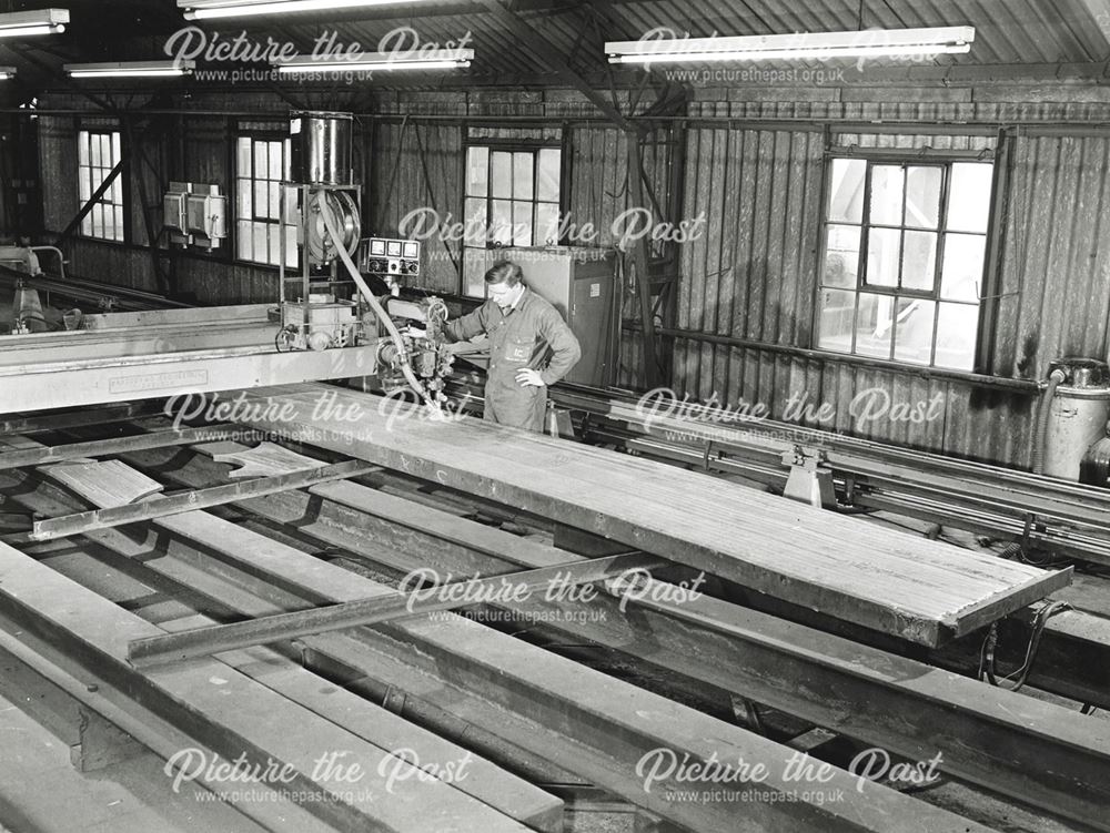 International Combustion Limited - Employee working on stainless steel cladding