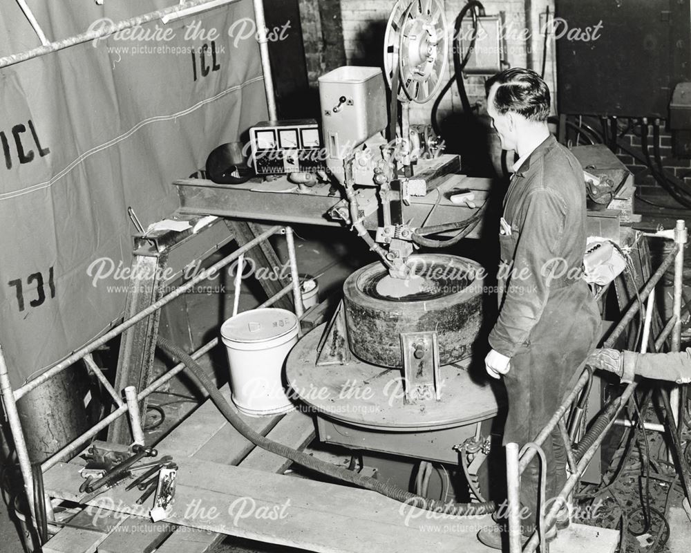 International Combustion Limited - Employee working on tube sheet surfacing by strip, to give low ca