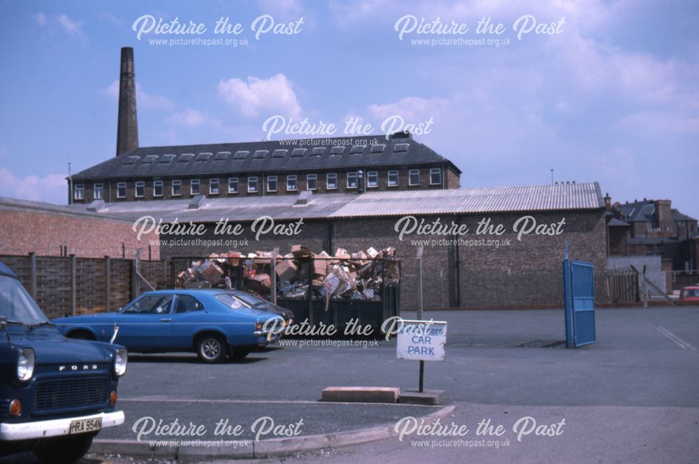 Bussell premises carpark on John Street with chimney in background