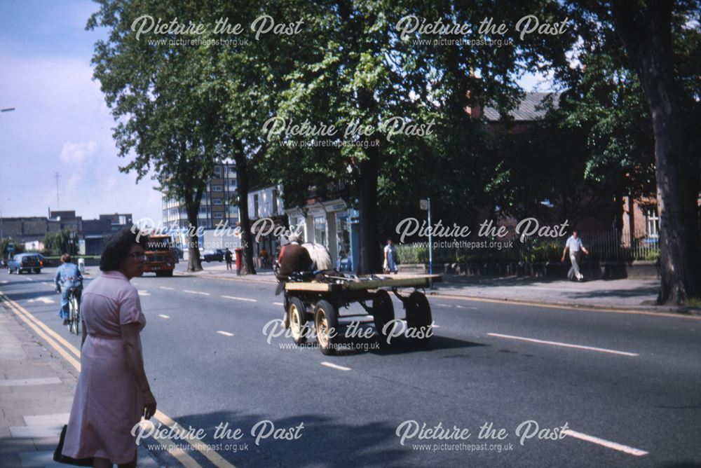 View along London Road,showing a horse and cart travelling along the road