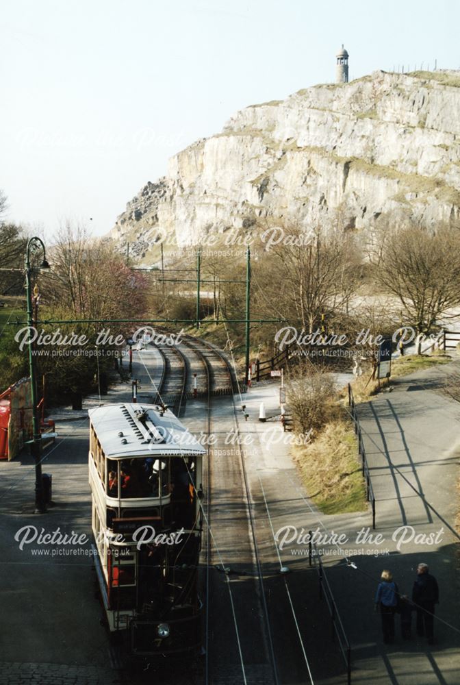 View along tram line with Crich Hill and Crich Memorial Tower in the background