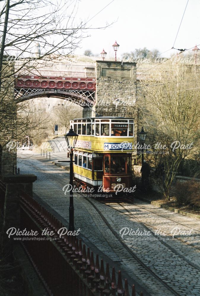 Tram passing under the historic Bowes-Lyon Bridge