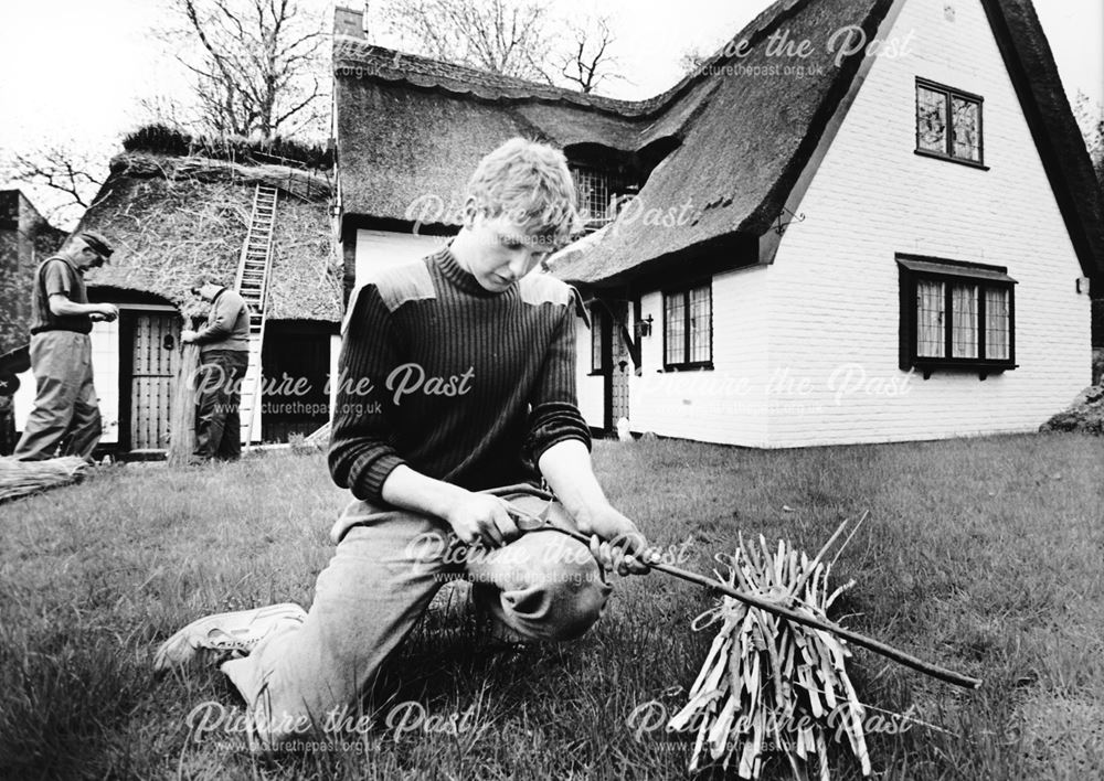 Thatchers re-thatching the roof on a property in The Hollow, Littleover, c 1980