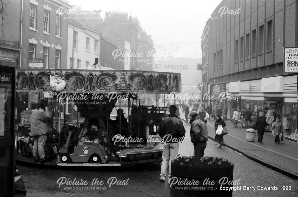 Cornmarket carousel in pedestrianised street 