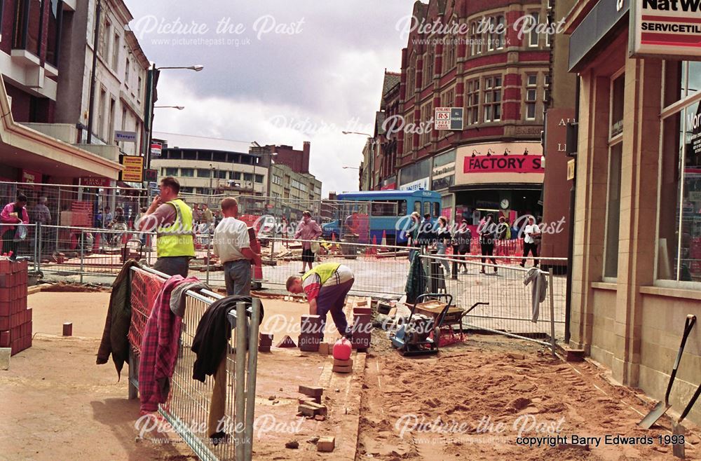 St Peter's Street workmen paving over roadway 